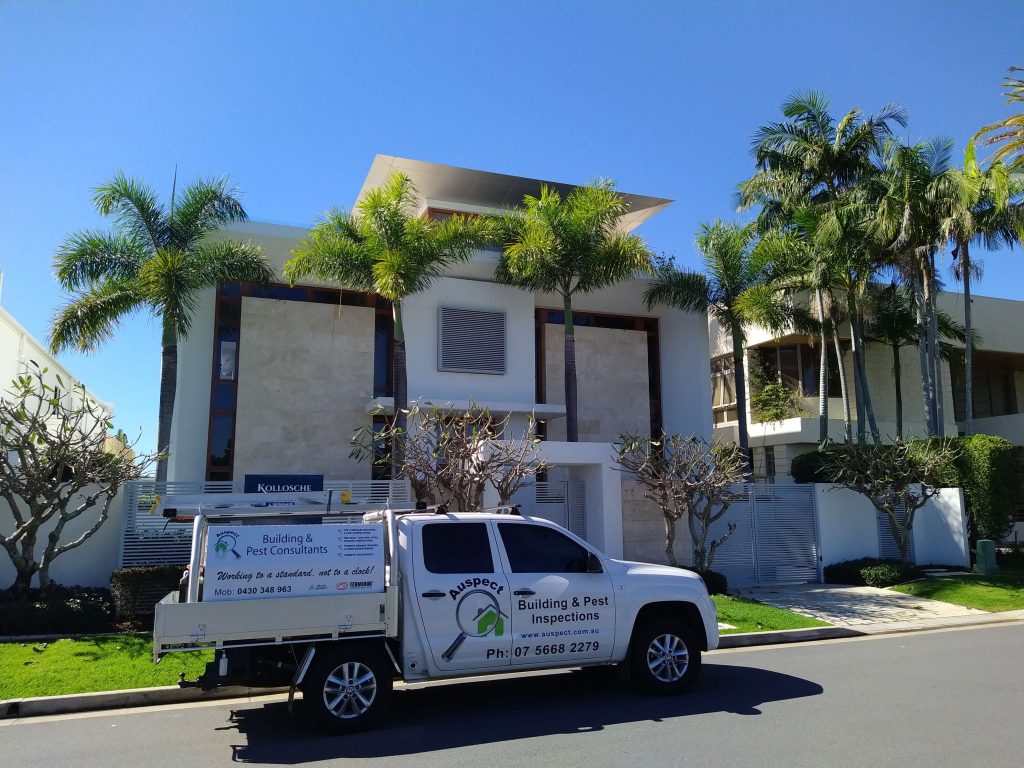 auspect company car in front of a house